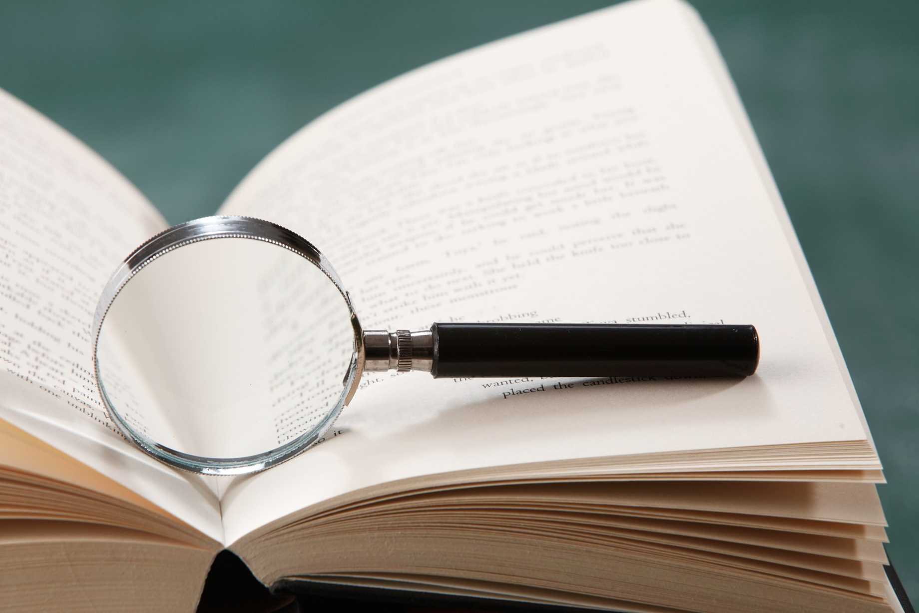 Open Book With Magnifying Glass